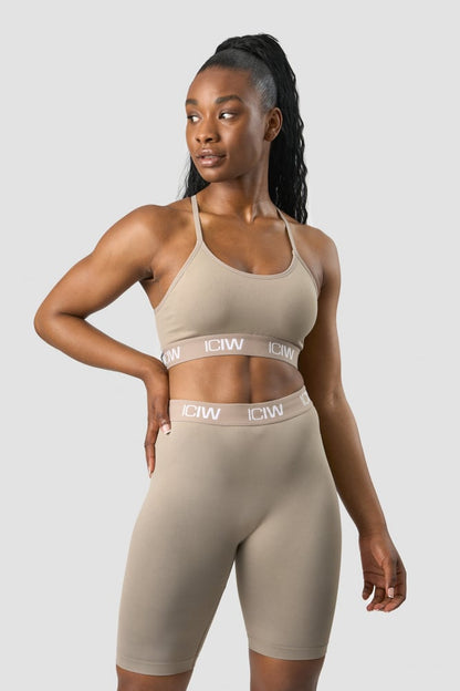 define seamless logo strappy sports bra taupe